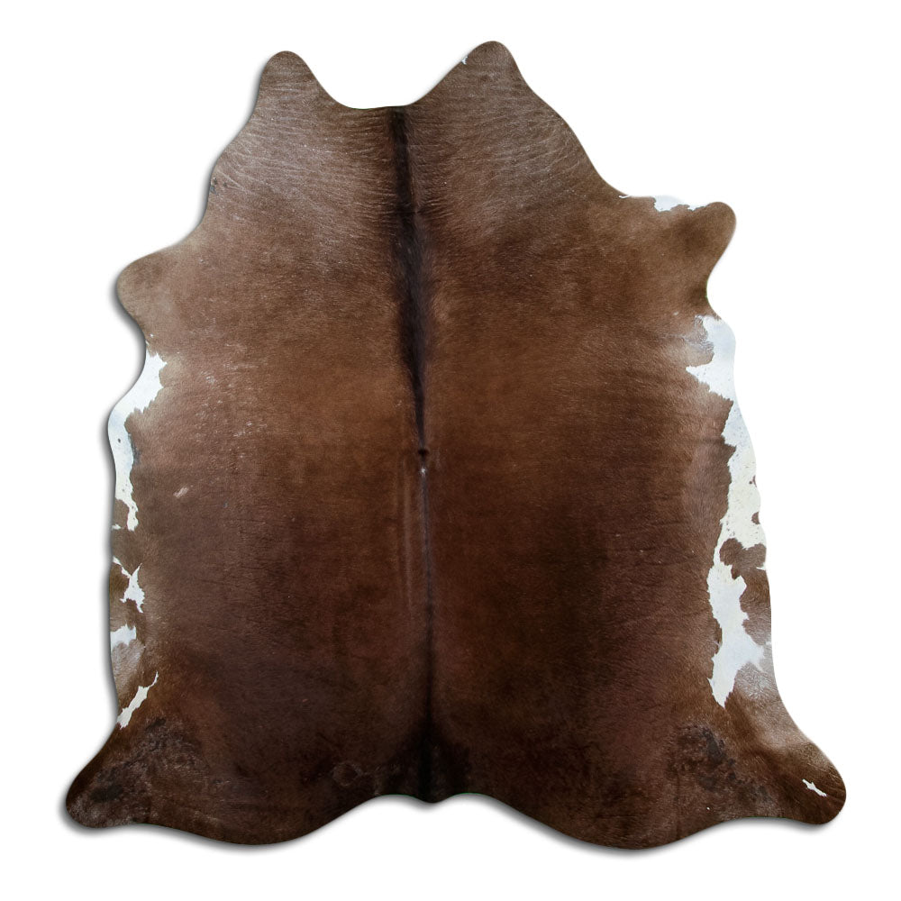 Brown cowhide rug of about 210 × 200 cm, seen from above: the exact hide you receive