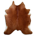 Brown cowhide rug of about 210 × 180 cm, seen from above: the exact hide you receive
