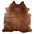 Brown cowhide rug of about 210 × 190 cm, seen from above: the exact hide you receive