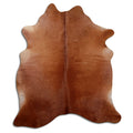 Brown cowhide rug of about 210 × 180 cm, seen from above: the exact hide you receive