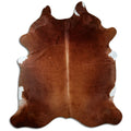 Brown cowhide rug of about 220 × 190 cm, seen from above: the exact hide you receive