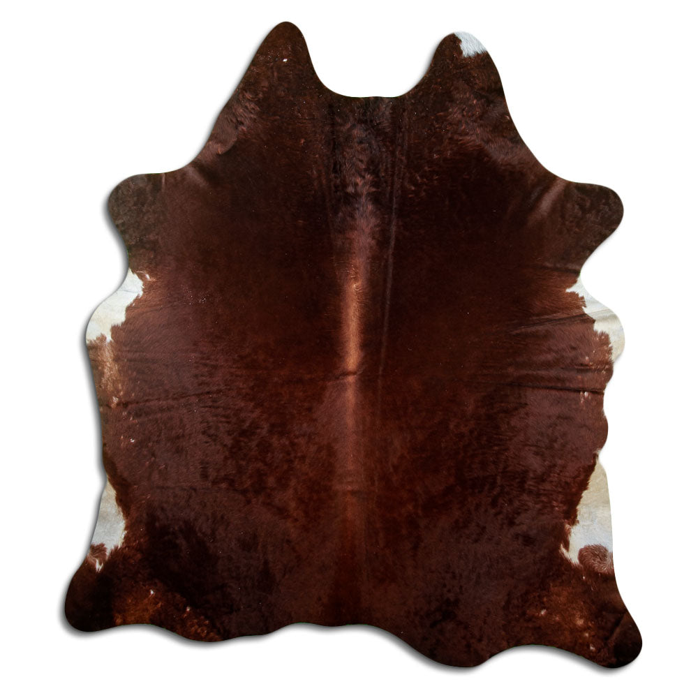 Brown cowhide rug of about 210 × 190 cm, seen from above: the exact hide you receive