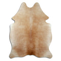 Brown cowhide rug of about 190 × 140 cm, seen from above: the exact hide you receive