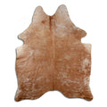 Brown cowhide rug of about 190 × 150 cm, seen from above: the exact hide you receive