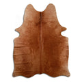 Brown cowhide rug of about 180 × 140 cm, seen from above: the exact hide you receive