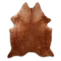 Brown cowhide rug of about 200 × 170 cm, seen from above: the exact hide you receive