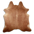 Brown cowhide rug of about 210 × 190 cm, seen from above: the exact hide you receive
