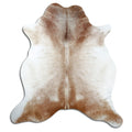Brown cowhide rug of about 240 × 220 cm, seen from above: the exact hide you receive