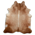 Brown cowhide rug of about 220 × 190 cm, seen from above: the exact hide you receive