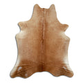 Brown cowhide rug of about 210 × 180 cm, seen from above: the exact hide you receive