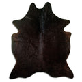 Brown cowhide rug of about 200 × 170 cm, seen from above: the exact hide you receive