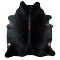 Brown cowhide rug of about 240 × 210 cm, seen from above: the exact hide you receive