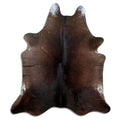 Brown cowhide rug of about 210 × 180 cm, seen from above: the exact hide you receive