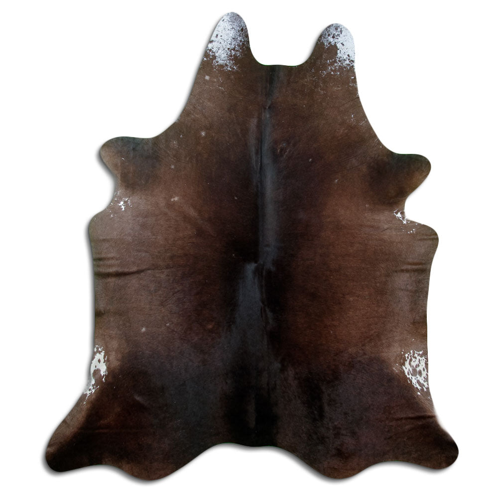 Brown cowhide rug of about 210 × 180 cm, seen from above: the exact hide you receive