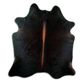 Brown cowhide rug of about 210 × 180 cm, seen from above: the exact hide you receive