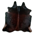 Brown cowhide rug of about 210 × 200 cm, seen from above: the exact hide you receive