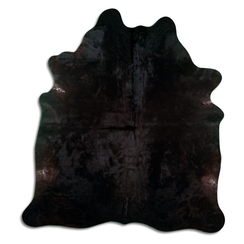 Brown cowhide rug of about 220 × 200 cm, seen from above: the exact hide you receive