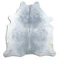 Grey cowhide rug of about 210 × 190 cm, seen from above: the exact hide you receive