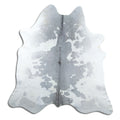 Grey cowhide rug of about 220 × 210 cm, seen from above: the exact hide you receive