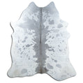 Grey cowhide rug of about 210 × 190 cm, seen from above: the exact hide you receive