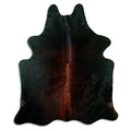 Brown cowhide rug of about 200 × 170 cm, seen from above: the exact hide you receive