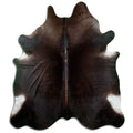 Brown cowhide rug of about 240 × 210 cm, seen from above: the exact hide you receive
