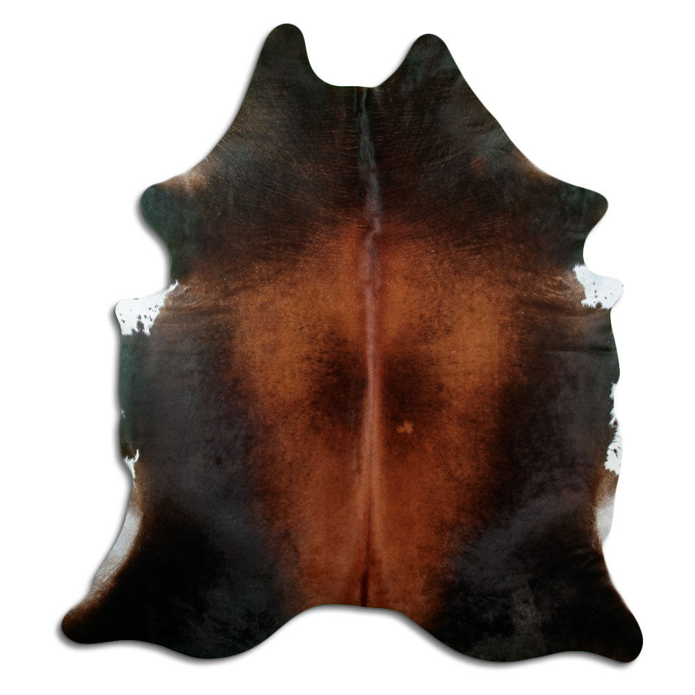 Brown cowhide rug of about 220 × 200 cm, seen from above: the exact hide you receive