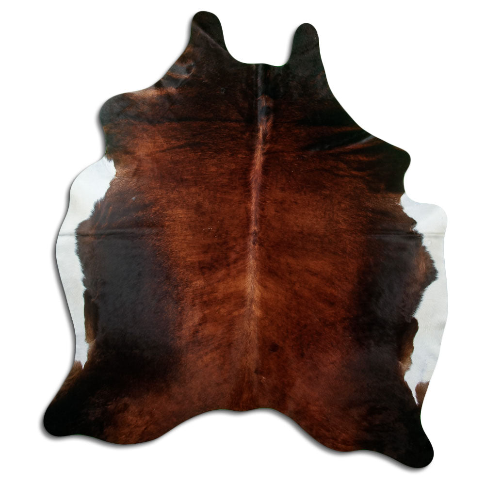 Brown cowhide rug of about 210 × 180 cm, seen from above: the exact hide you receive