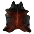 Brown cowhide rug of about 200 × 190 cm, seen from above: the exact hide you receive