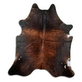 Brown cowhide rug of about 220 × 200 cm, seen from above: the exact hide you receive