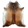 Brown cowhide rug of about 220 × 190 cm, seen from above: the exact hide you receive