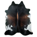 Brown cowhide rug of about 220 × 180 cm, seen from above: the exact hide you receive