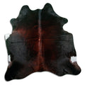 Brown cowhide rug of about 180 × 180 cm, seen from above: the exact hide you receive