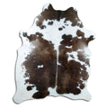 Tricolour cowhide rug of about 190 × 150 cm, seen from above: the exact hide you receive