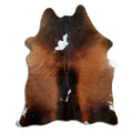Tricolour cowhide rug of about 200 × 160 cm, seen from above: the exact hide you receive