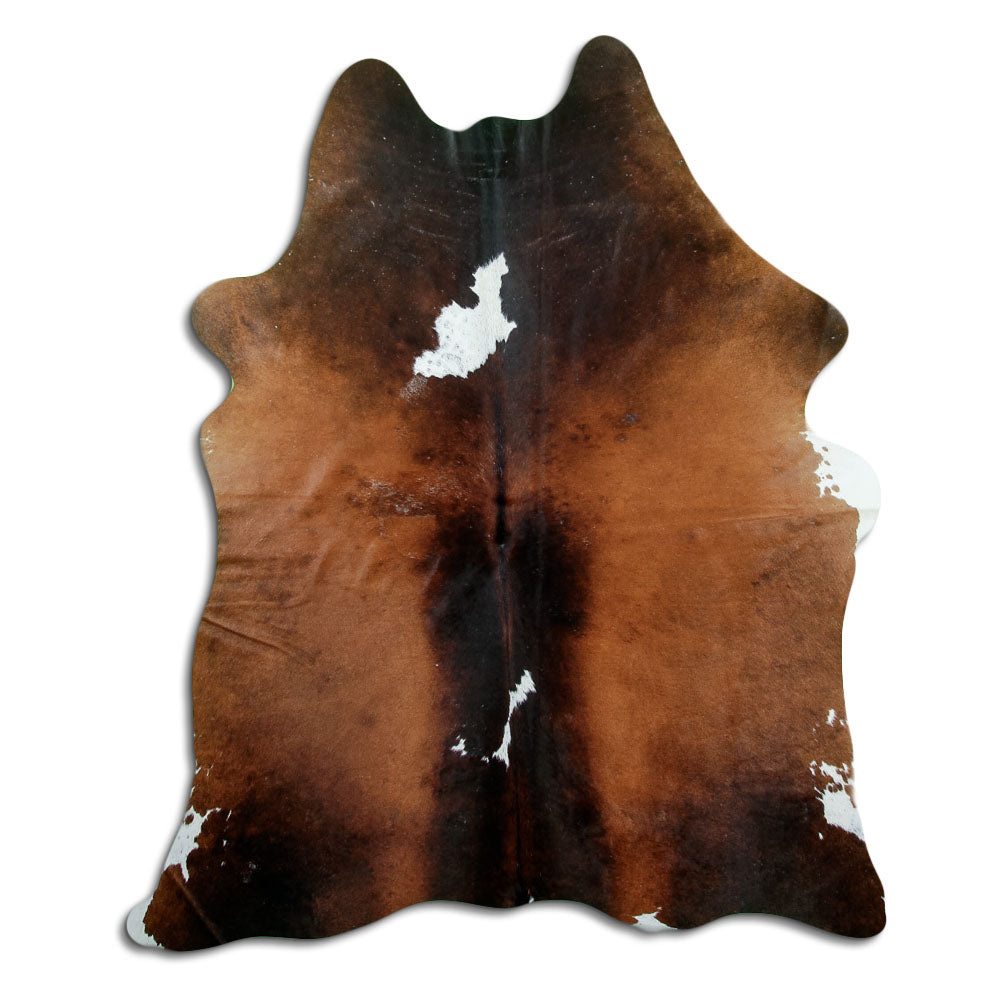 Tricolour cowhide rug of about 200 × 160 cm, seen from above: the exact hide you receive