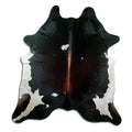 Tricolour cowhide rug of about 210 × 200 cm, seen from above: the exact hide you receive