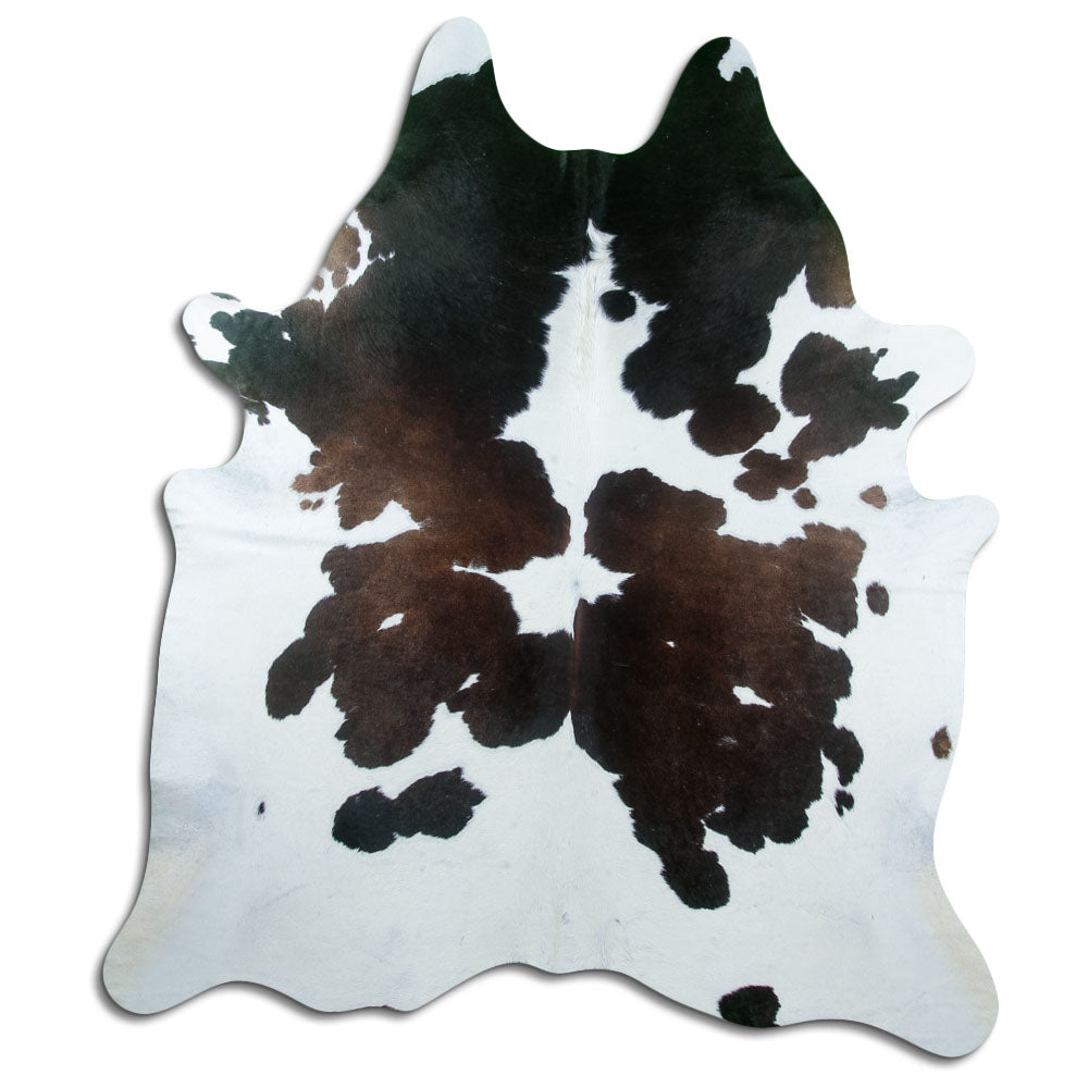 Tricolour cowhide rug of about 220 × 190 cm, seen from above: the exact hide you receive