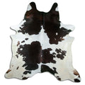 Tricolour cowhide rug of about 230 × 220 cm, seen from above: the exact hide you receive