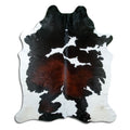 Tricolour cowhide rug of about 220 × 190 cm, seen from above: the exact hide you receive