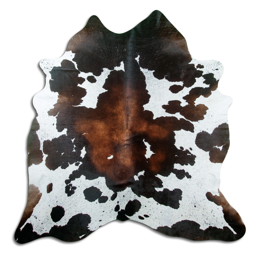 Tricolour cowhide rug of about 190 × 190 cm, seen from above: the exact hide you receive
