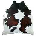 Tricolour cowhide rug of about 210 × 190 cm, seen from above: the exact hide you receive