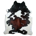 Tricolour cowhide rug of about 240 × 210 cm, seen from above: the exact hide you receive