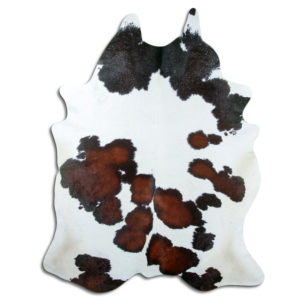 Tricolour cowhide rug of about 230 × 180 cm, seen from above: the exact hide you receive