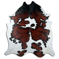 Tricolour cowhide rug of about 250 × 220 cm, seen from above: the exact hide you receive