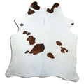 Tricolour cowhide rug of about 190 × 190 cm, seen from above: the exact hide you receive