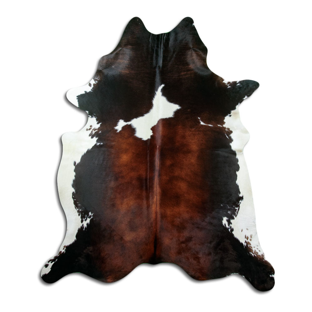 Tricolour cowhide rug of about 220 × 190 cm, seen from above: the exact hide you receive