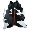 Tricolour cowhide rug of about 240 × 200 cm, seen from above: the exact hide you receive