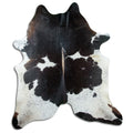 Tricolour cowhide rug of about 240 × 220 cm, seen from above: the exact hide you receive