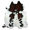 Tricolour cowhide rug of about 230 × 210 cm, seen from above: the exact hide you receive